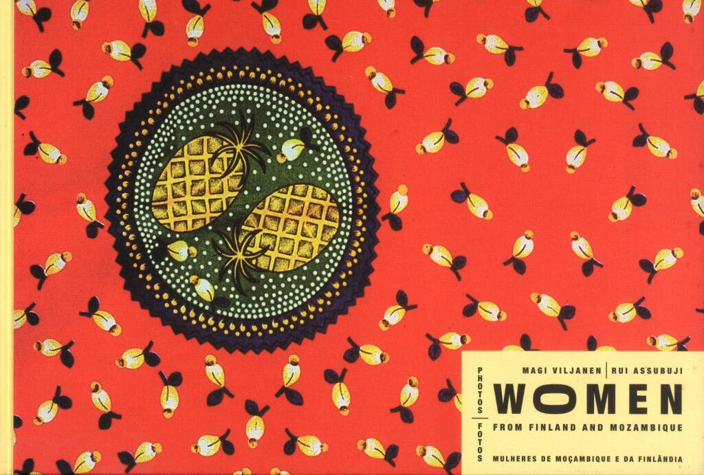 Book cover of Women: Photos from Finland and Mozambique by Magi Viljanen and Rui Assubuji, featuring a red patterned textile design with a circular motif.