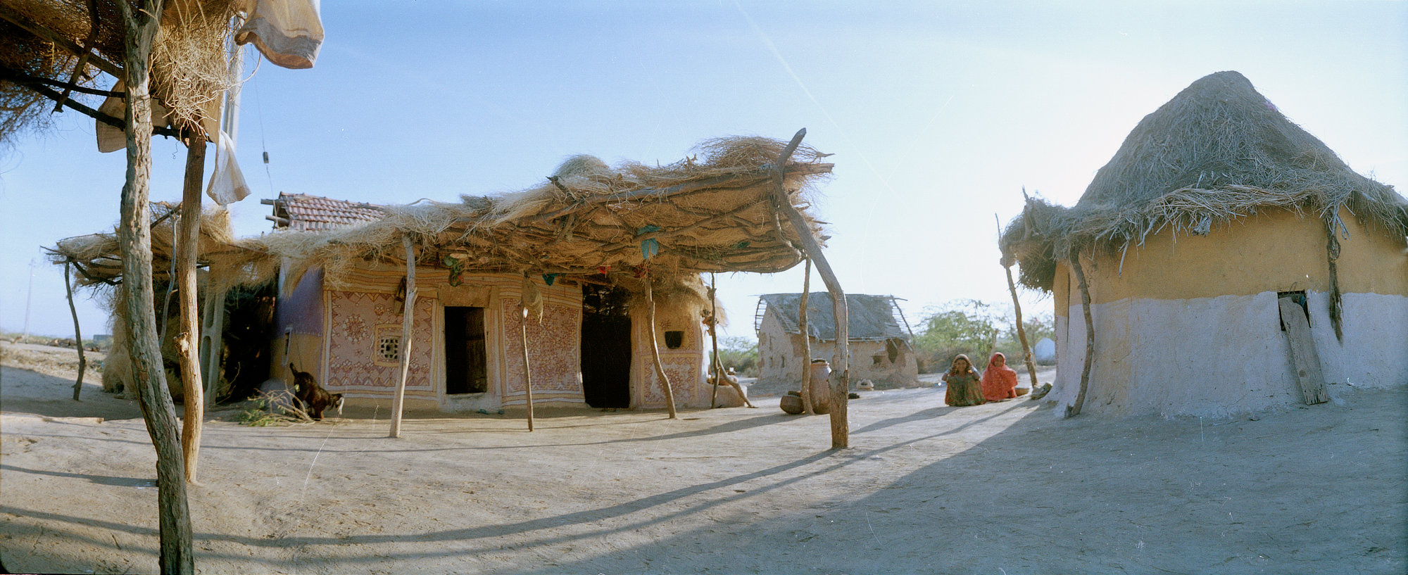 Traditional mud houses with thatched roofs in a village in Kutch, Gujarat, India.