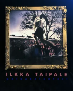 Exhibition poster for Ilkka Taipale – Calendar Boy, featuring a humorous portrait by photographer Magi Viljanen in an ornate frame.